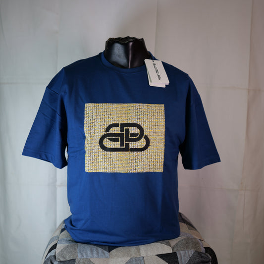 Blue t-shirt with a logo on a mannequin against a plain background